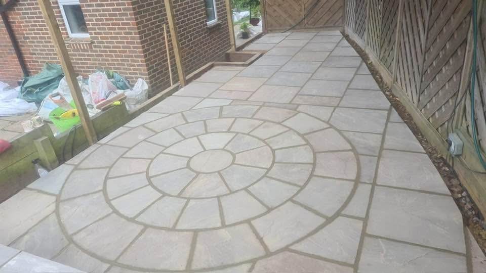Decorative circle-feature sandstone patio